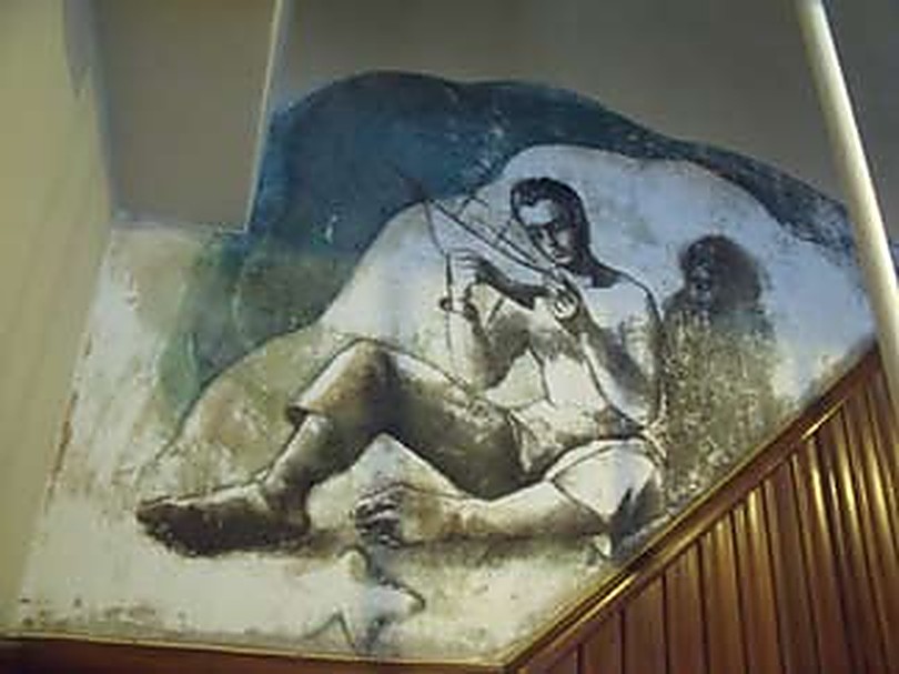 Mural del noi amb l'estel abans de la restauració